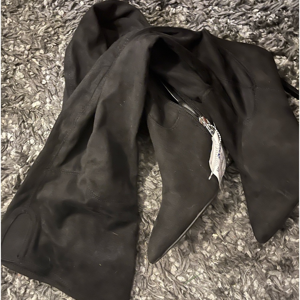 Black tall velour boots.